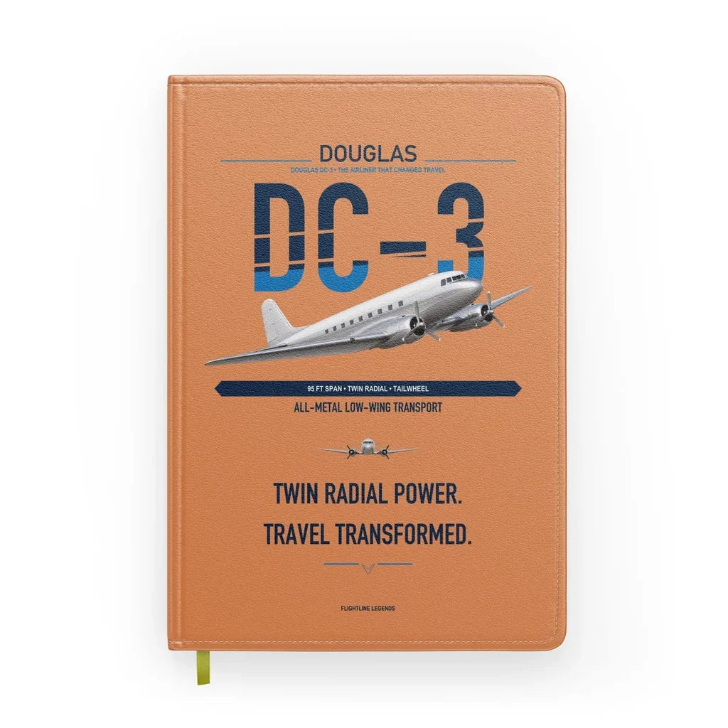 Douglas DC-3 design on orange notebook