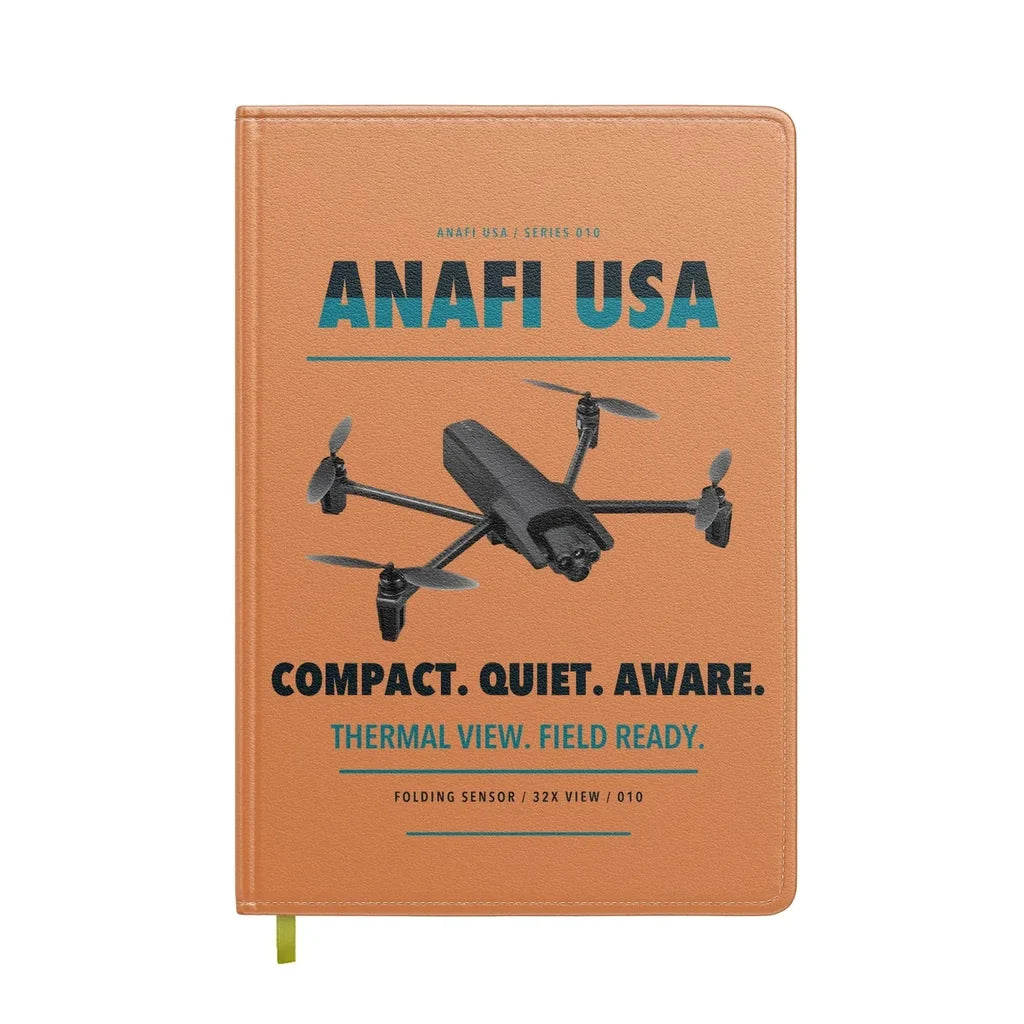 Parrot ANAFI USA design on orange notebook