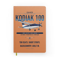 Thumbnail for Daher Kodiak 100 Series III design on orange notebook