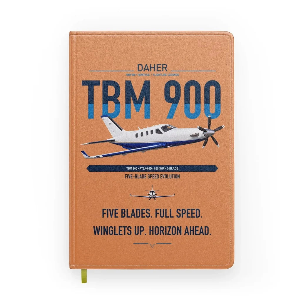 Daher TBM 900 design on orange notebook