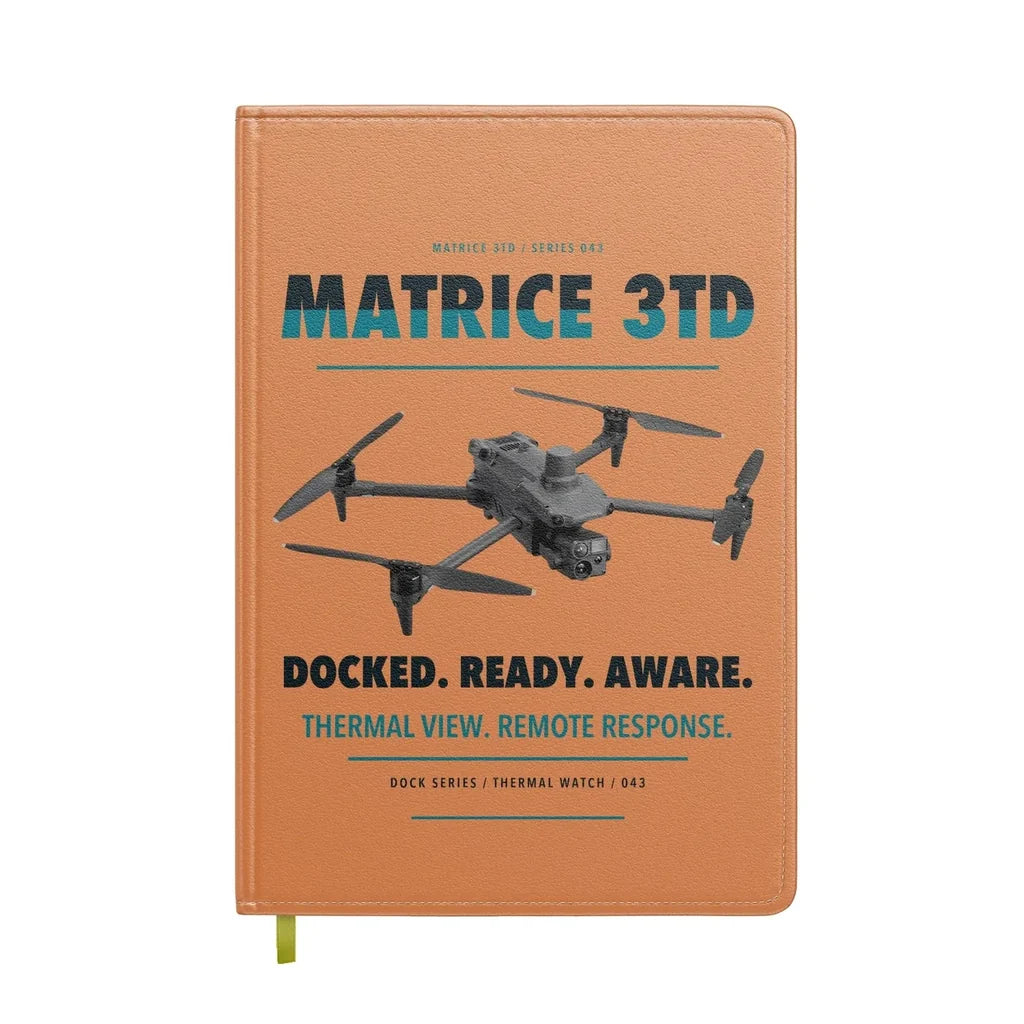DJI Matrice 3TD design on orange notebook