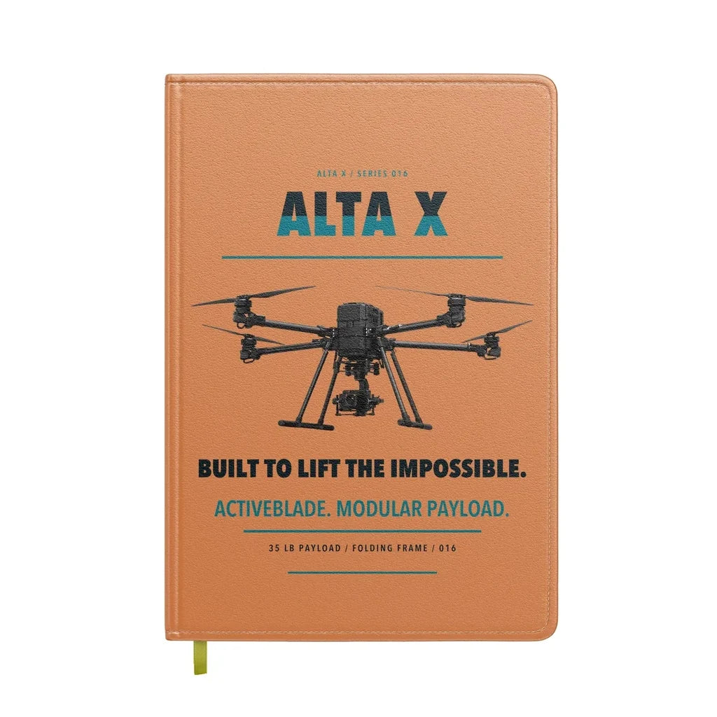 Freefly Alta X design on orange notebook