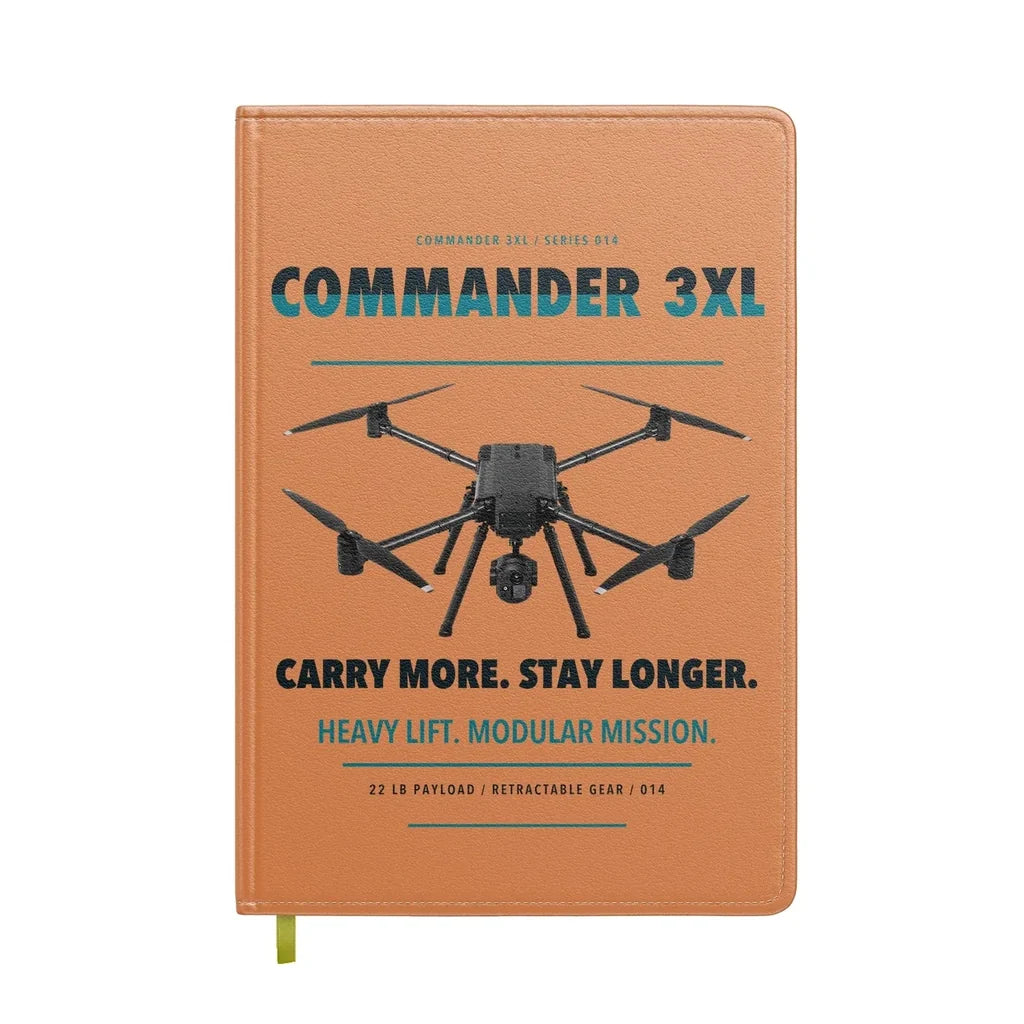 Draganfly Commander 3XL design on orange notebook
