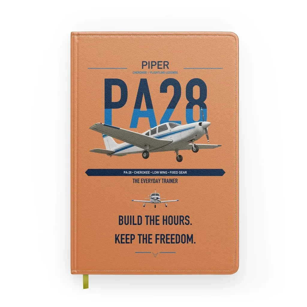 Piper PA-28 Cherokee design on orange notebook