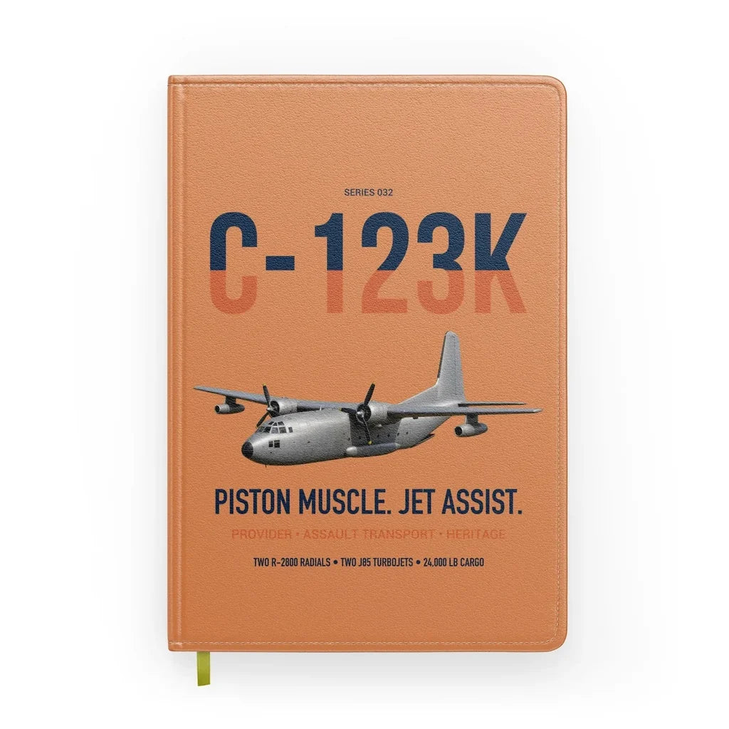 C-123K Provider design on orange notebook
