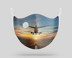Airplane over Runway Towards the Sunrise Designed Face Masks