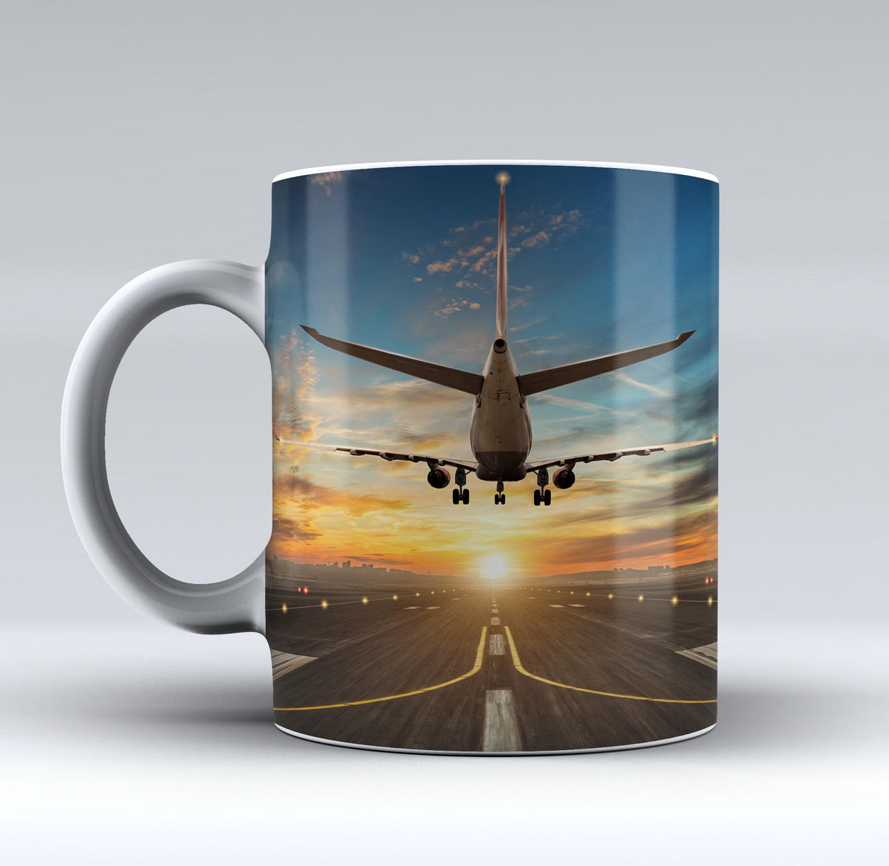 Airplane over Runway Towards the Sunrise Designed Mugs