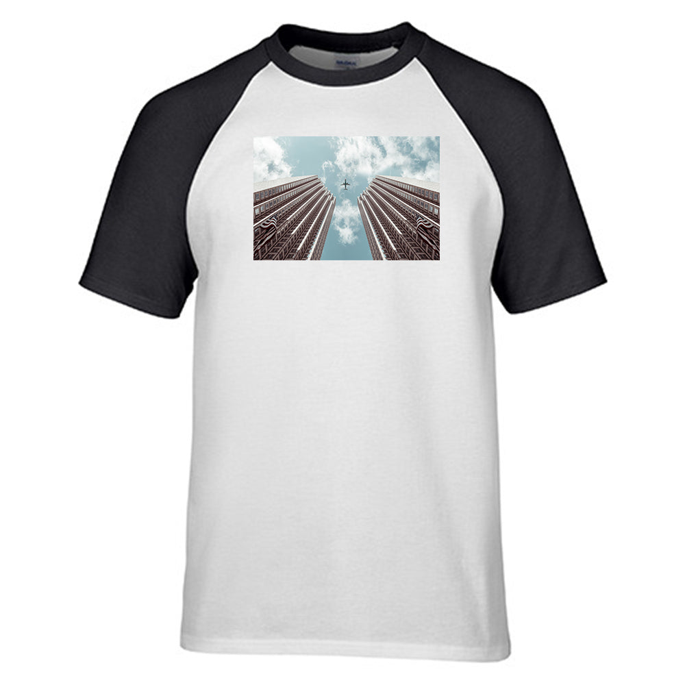 Airplane Flying over Big Buildings Designed Raglan T-Shirts