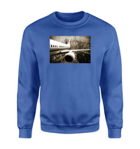 Thumbnail for Departing Aircraft & City Scene behind Designed Sweatshirts
