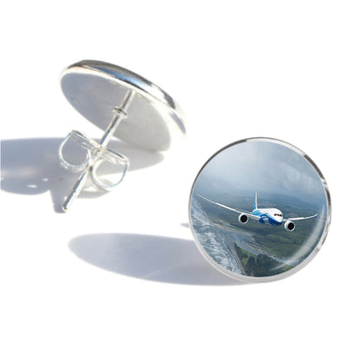 Cruising Boeing 787 aviation-themed stud earrings, polished stainless steel.