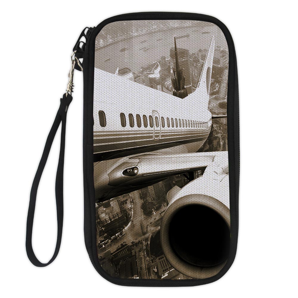 Departing Aircraft & City Scene behind Designed Travel Cases & Wallets