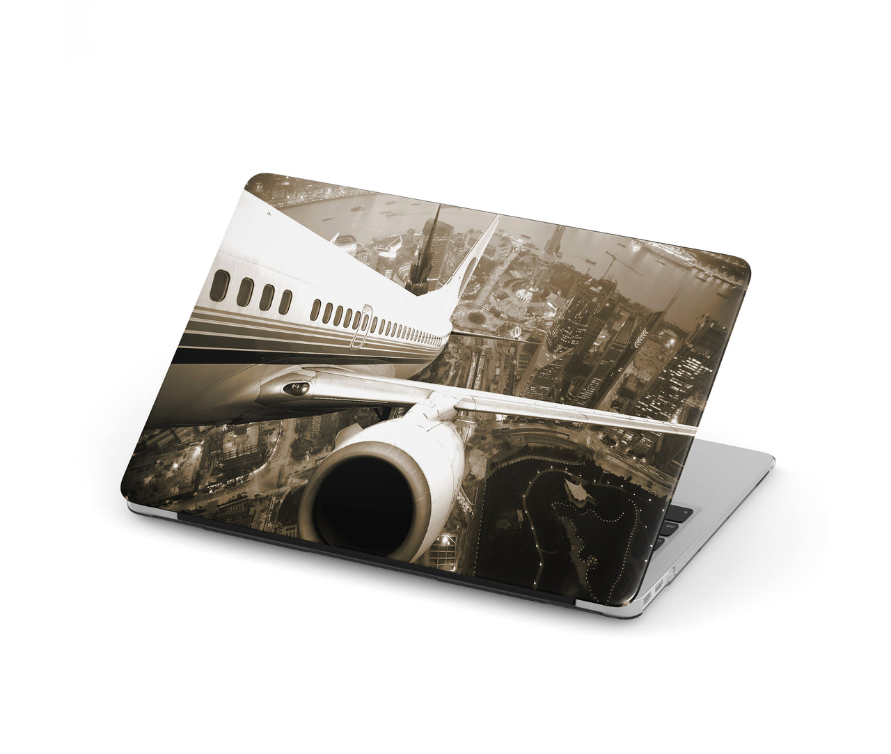 Departing Aircraft & City Scene behind Designed Macbook Cases