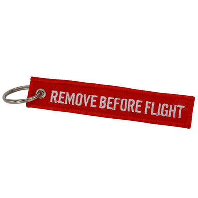 Red aviation Remove Before Flight key chain, aviation-tag style webbing.